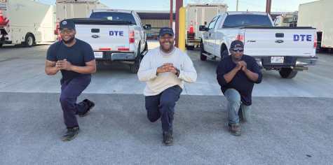 3 DTE employees warming up for the day by doing split squats before their shift